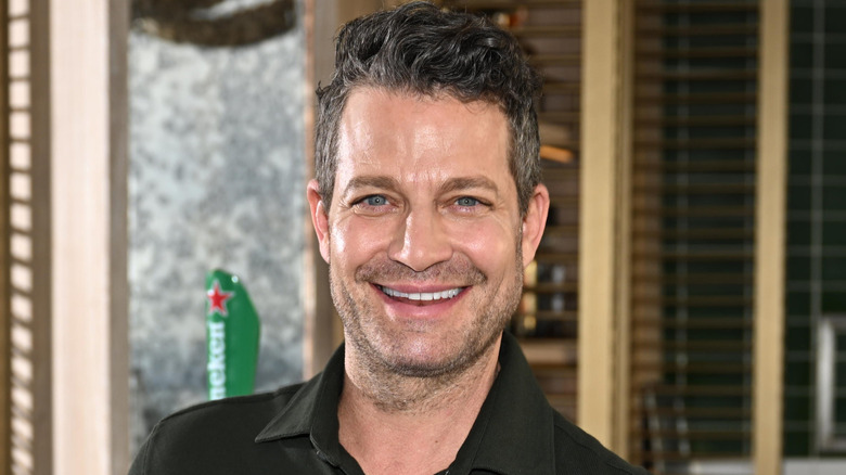 Nate Berkus leaning on bar