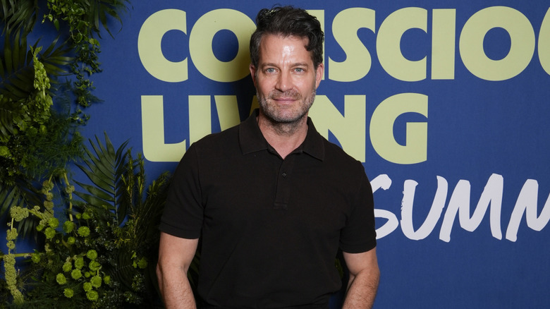 Nate Berkus wearing black polo shirt and smiling