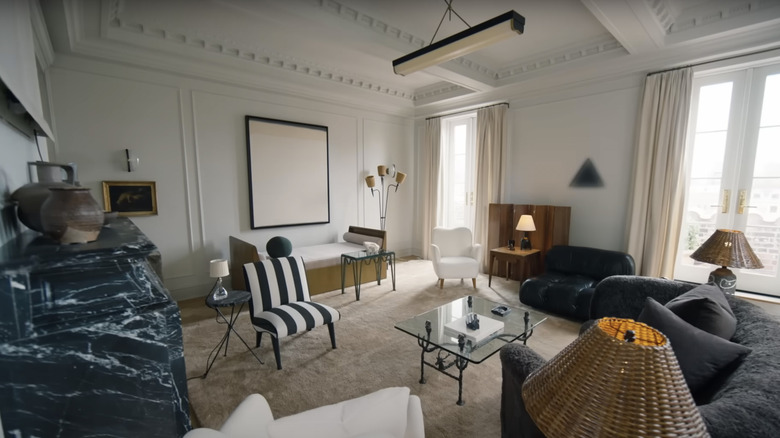 Elaborate pre-war crown molding and wall trim is shown in Nate Berkus and Jeremiah Brent's living room