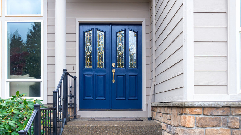 A traditional navy blue front door.