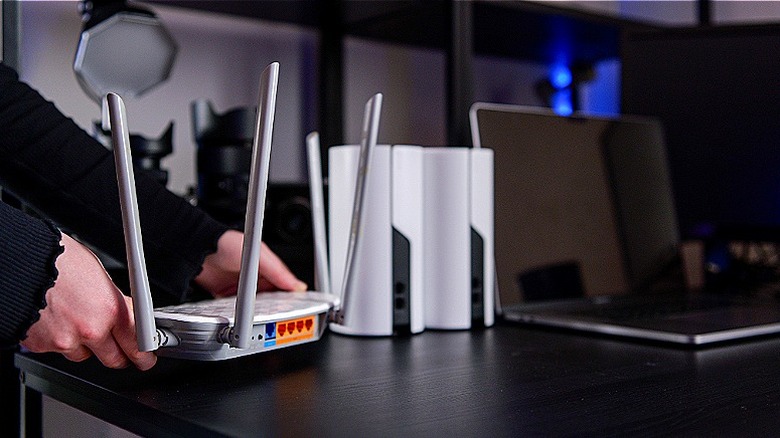 A person setting up a Wi-Fi network at home