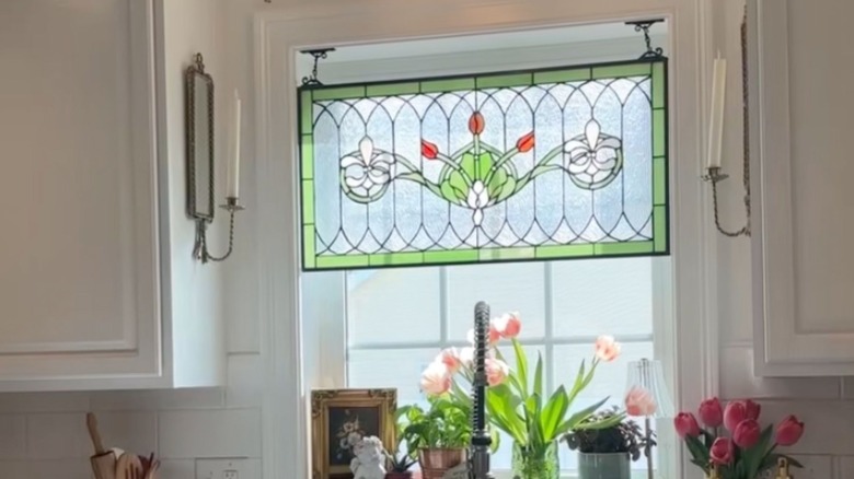 Vintage stained glass hanging over a window