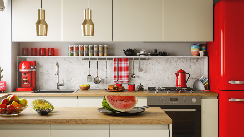 Kitchen with red fridge and coffee machine