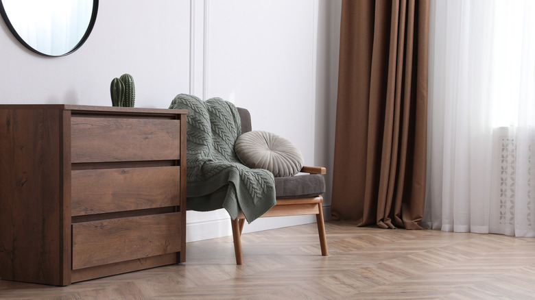 A spacious living room with different wood tones