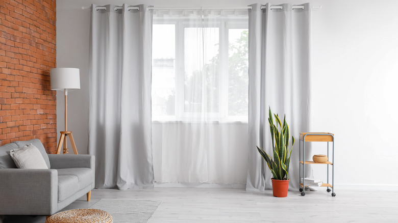 sheer curtains in industrial living room