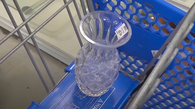 a crystal vase in a shopping cart