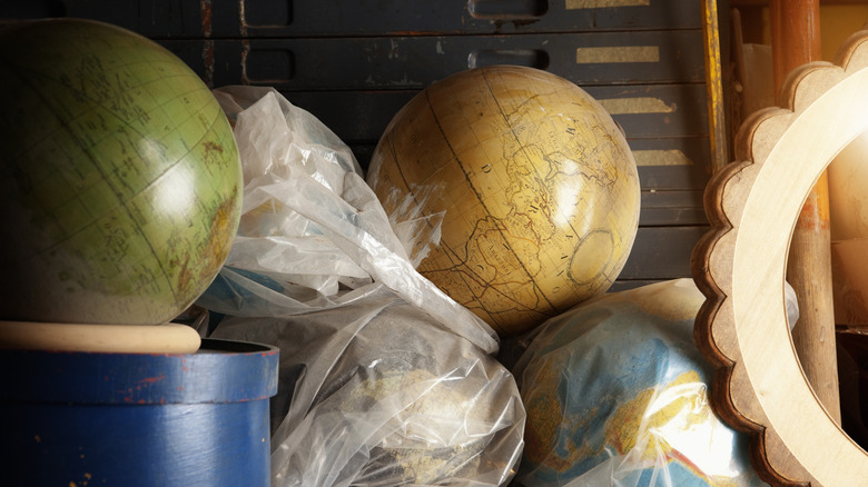 a stack of vintage globes