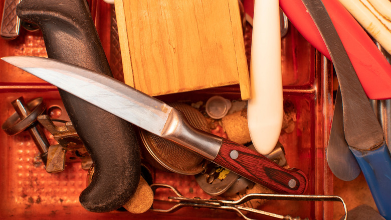 A disorganized pile of kitchen utensils