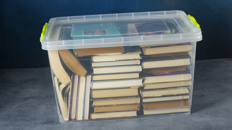 Books packed neatly inside a plastic container