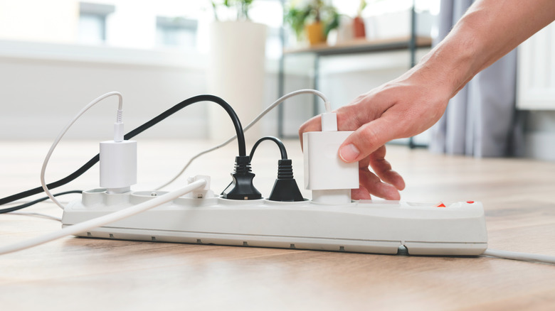 a power strip with phone chargers connected to it