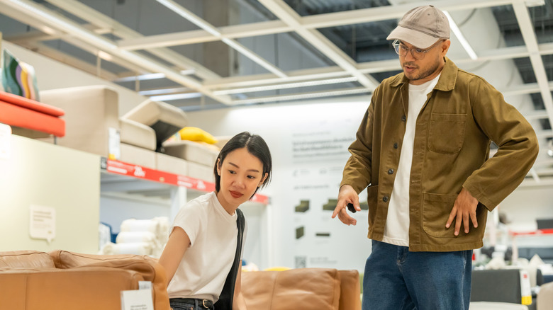 couple shopping for furniture in IKEA