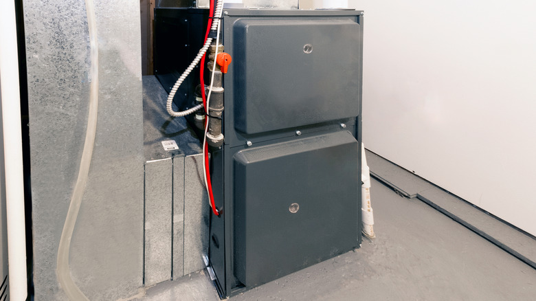A high efficiency furnace installed in the basement of a home