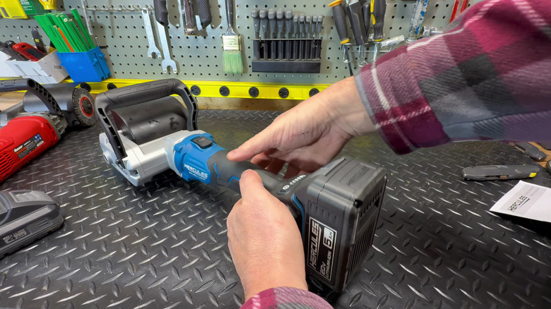 A person holding the new Hercules Cordless Surface Conditioning Tool