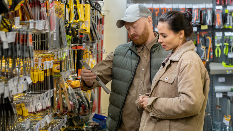 A couple shopping in a hardware store