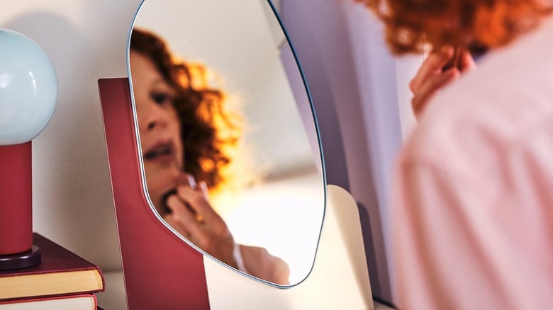 woman looking at herself in the IKEA mirror