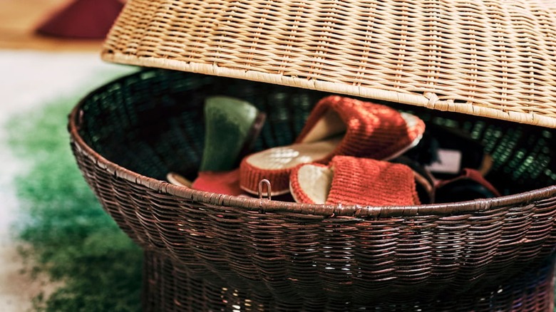rattan ottoman open to reveal shoe storage