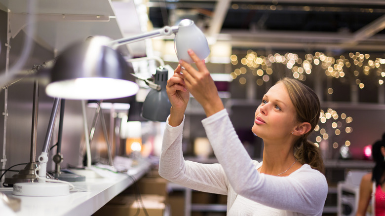 woman shopping for lighting