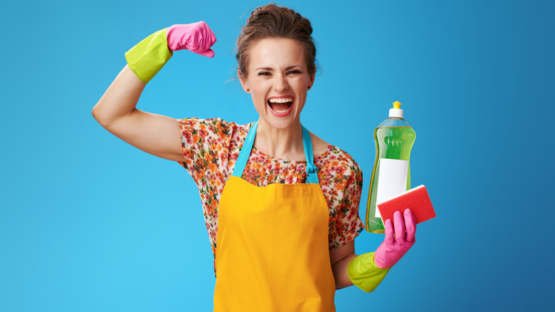 woman wearing cleaning gloves