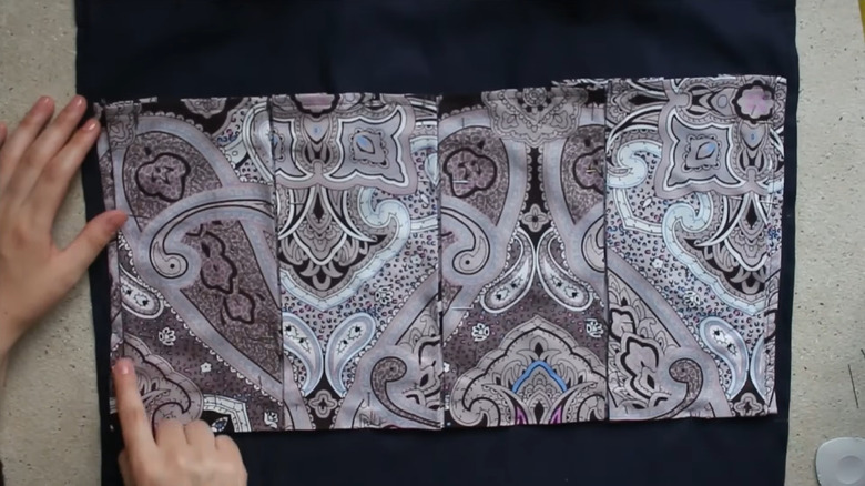 pockets for hanging shoe storage are sewn on in rows, with pleats to create space and vertical stitching for dividers