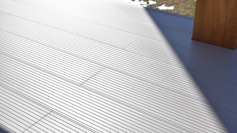 A deck under construction with aluminum boards