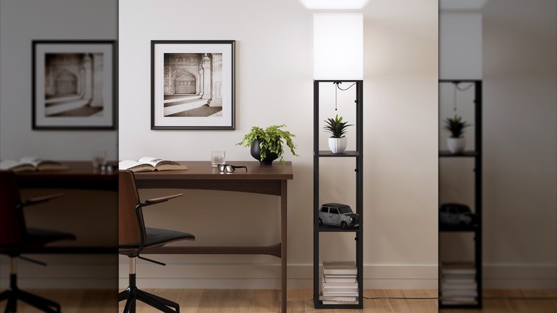 Floor lamp with shelves in an office setting