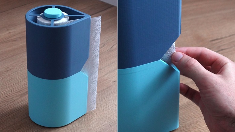 On the left, a 3D-printed paper towel holder in two different shades of blue. On the right, a close-up image of a person's hand pulling paper towels out of the holder.