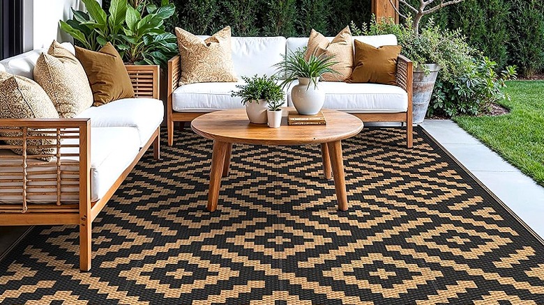 An Aztec pattern rug and modern patio furniture.