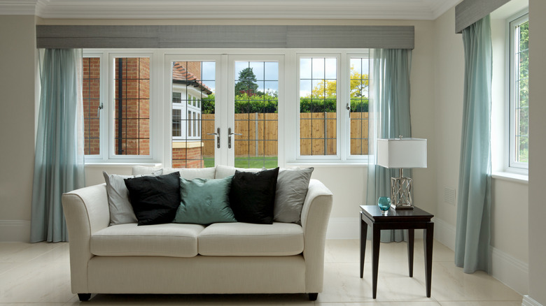 Room with window cornices and drapery