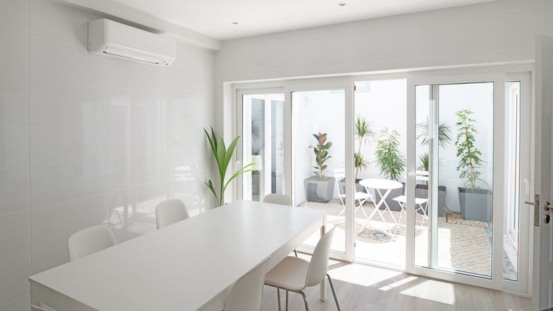 Modern dining room with sliding glass doors
