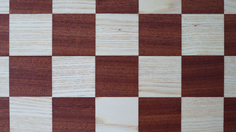 Closeup photo of checkerboard-patterned wooden floor