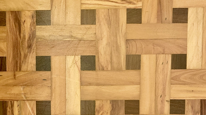 Closeup of a wooden floor with a double basket weave pattern