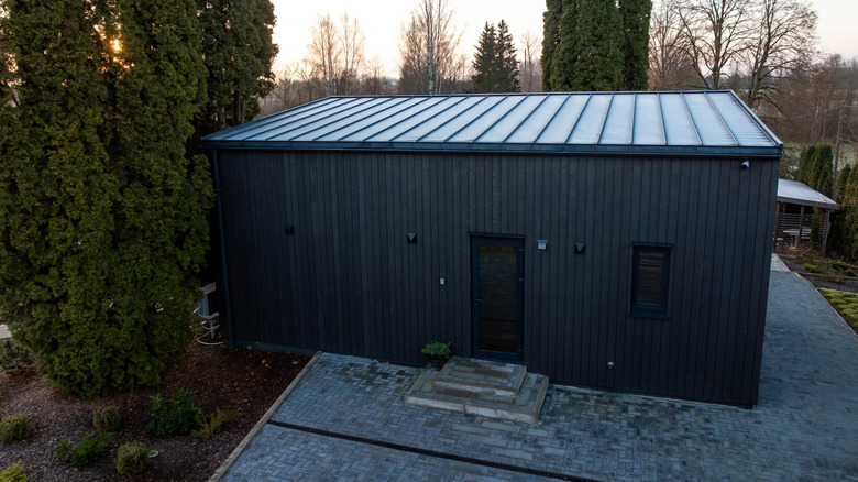 A minimalist building clad in Shou Sugi Ban