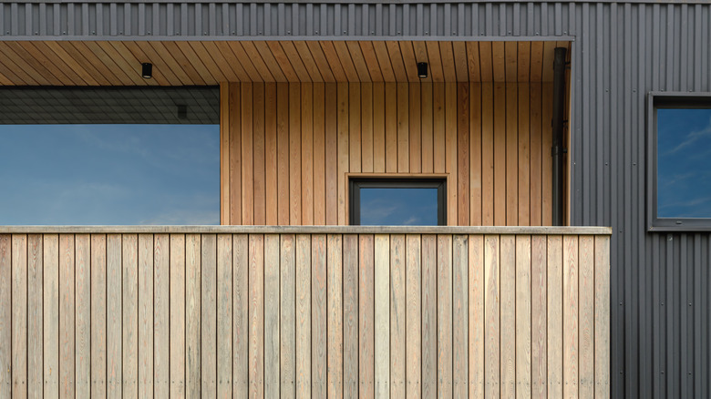 A contemporary home with vertical wood siding