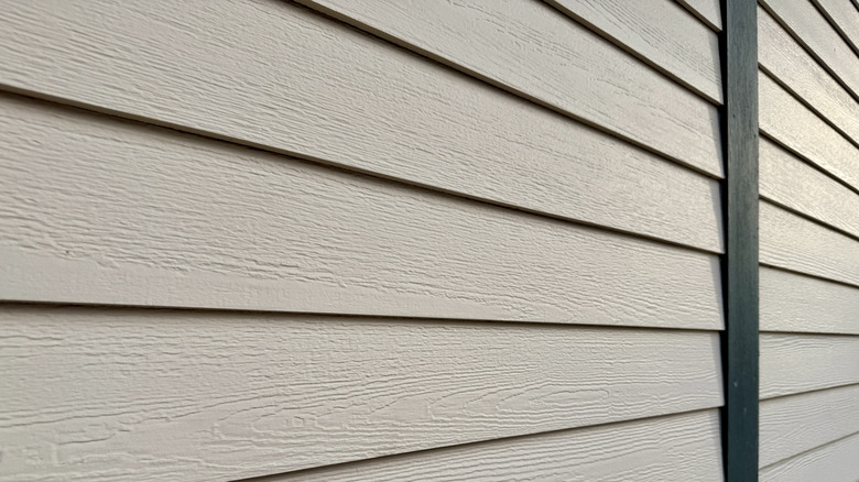 A wall of a home protected with wood-look siding