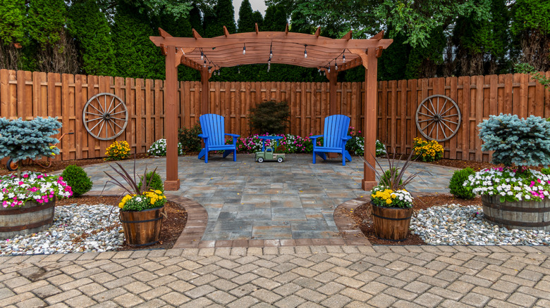 A backyard patio made with richly colored pavers