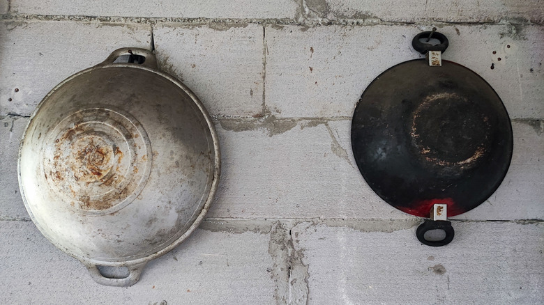 Two old used frying pans