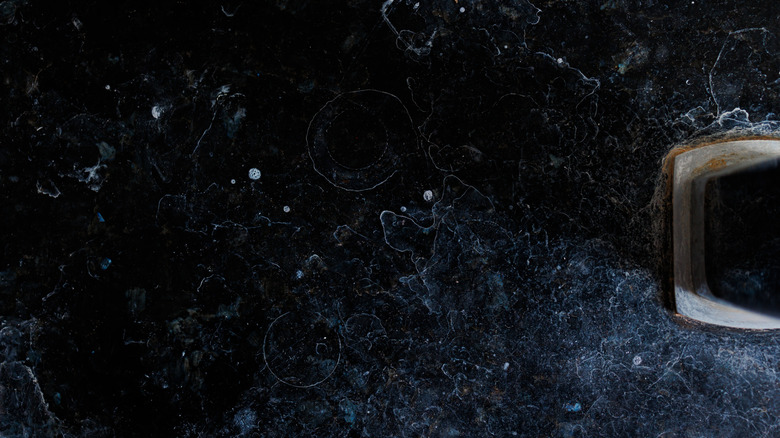 Hard water stains on bathroom floor