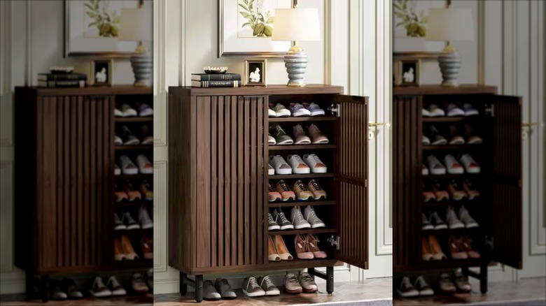 The BYBLIGHT Lauren shoe cabinet from Home Depot set up in an entryway with shoes inside.