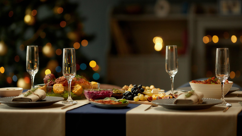 Empty champagne flutes with fruit served on a dining table
