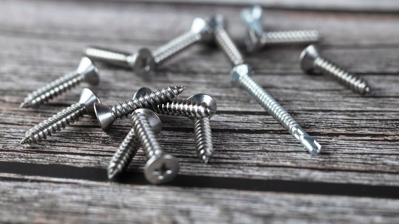 screws laying on wood