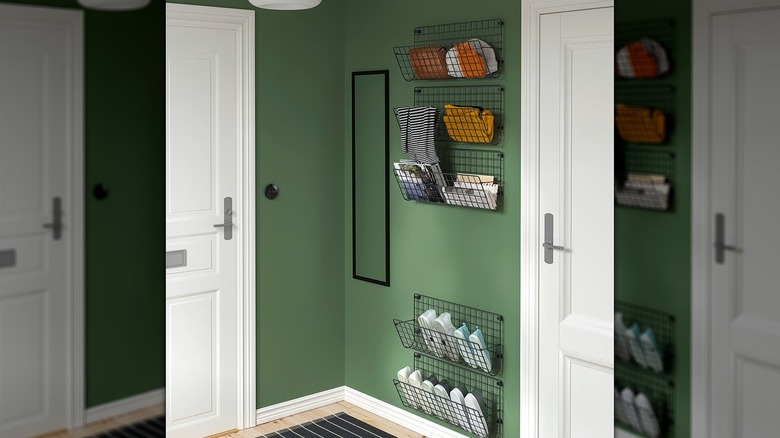 IKEA GREJIG wall-mounted wire rack on green wall