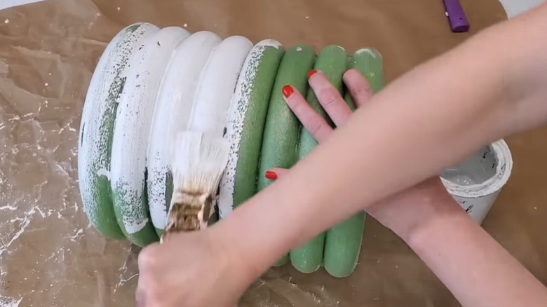Demonstrator hand painting the wreath column