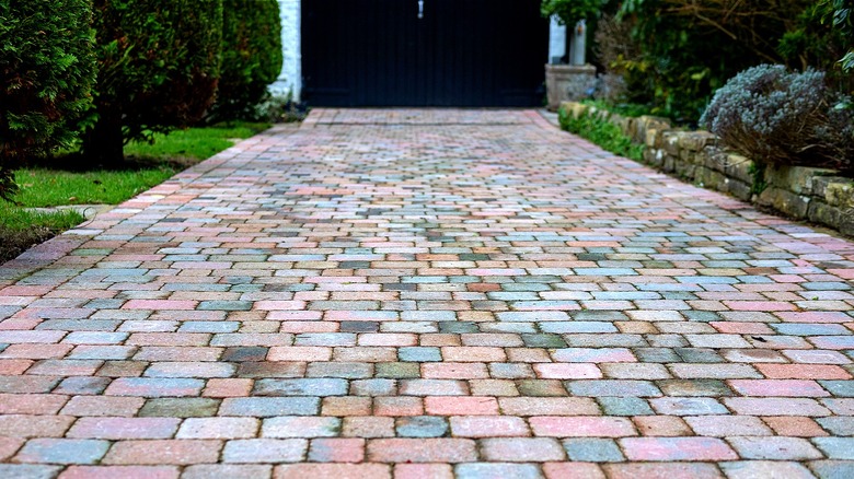 Home with paver driveway design and no driveway edging