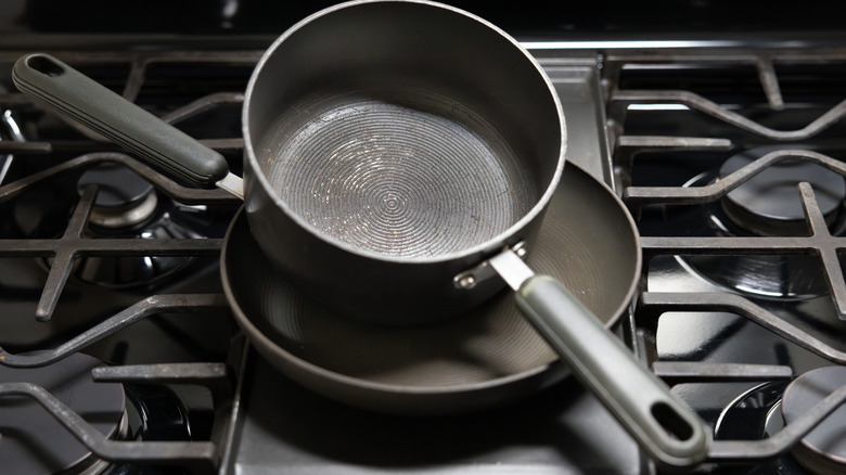 Nonstick frying pans on stove burners