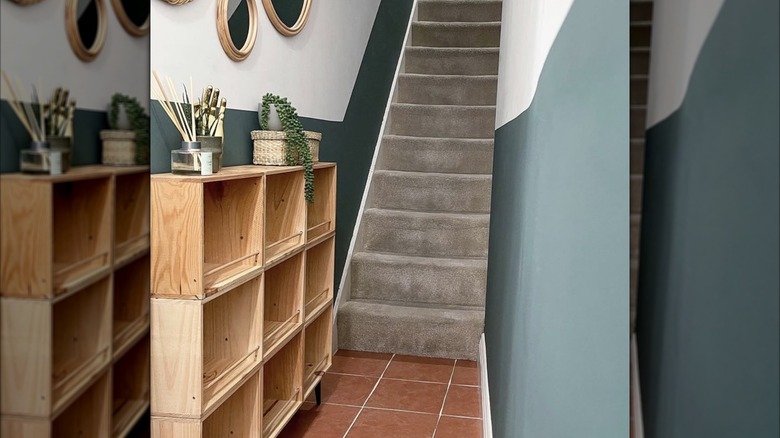 A shoe shelf made from upcycled wine crates in the entryway to a home.