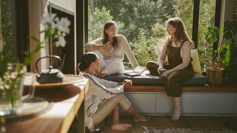Women sitting together in a relaxing living room