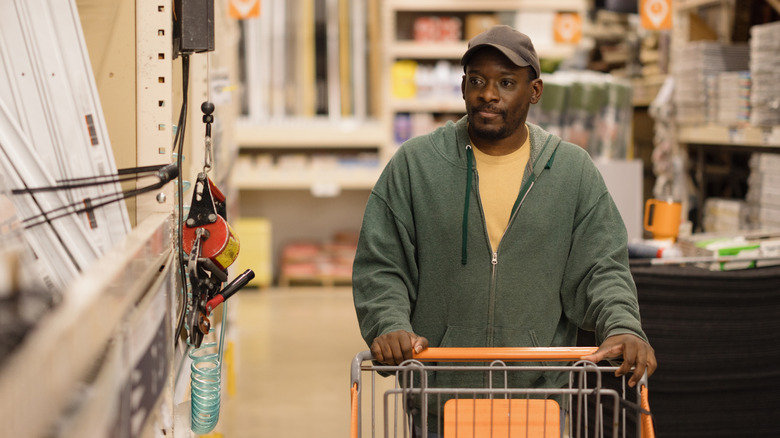 Man shopping at a hardware store.