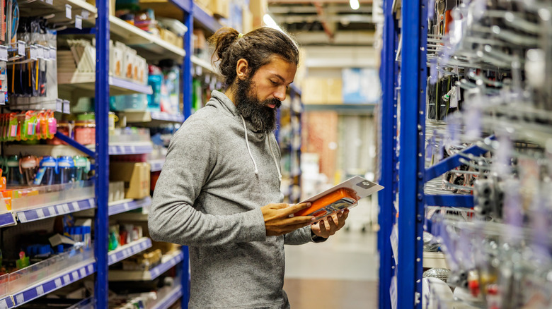 Man shopping at a hardware store.
