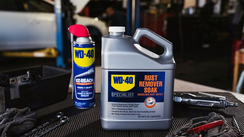 WD-40 Specialist Rust Remover Soak bottle next to a WD-40 spray can