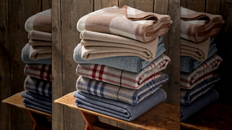 Stack of folded plad wool L.L. Bean blankets